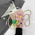 Mini woven straw bucket bag with pink flower decoration and white drawstring closure - Pink