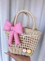 Detailed macro shot of beige woven tote bag with pink satin bow and tulip flower decor - Beige Pink Bow