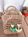 Detailed close-up of woven straw handbag with Beautiful embroidery and tulip charms - Khaki Tulip Ornament