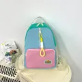 Lightweight color-block casual backpack with pastel blue, green, and pink panels - Pink