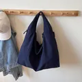Large navy blue hobo shoulder bag in pleated waterproof fabric with wide strap design - Dark Blue
