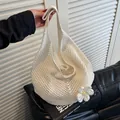 Cream knit crochet tote bag featuring a white daisy flower accent and mesh hollow texture - White