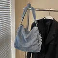 Borsa a tracolla in denim lavato blu con cuciture a contrasto e tracolla regolabile - Blu Denim