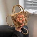 Woven straw bucket bag in light brown with a large orange floral decor and crossbody strap - Orange Pink Sunflower Style / Khaki