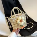 Handwoven beige bucket bag featuring a white floral appliqué and cherry charm detail - Cream White Flower Cherry Style / Off White