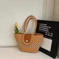 Striped woven tote bag with camel base, pearl closure, and brown leather flap detail - Khaki