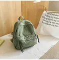 Saliegroene canvas mini rugzak voor dames in vintage stijl met ritssluiting vak - Groen