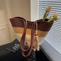 Three-tone woven tote bag in dark brown, khaki, and cream stripes with tassel - Brown