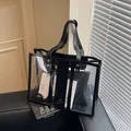 Transparent PVC tote bag with black leather trim and matching inner pouch on a sofa - Transparent Style (With Inner Bag) / Clear