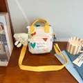 Cream crossbody bag with colorful heart prints and a yellow strap for kids - Beige