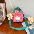 Pink heart patterned kids shoulder bag with green straps and cute plush pendant - Pink
