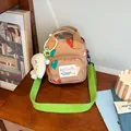 Cute brown canvas crossbody bag with colorful hearts and adjustable green strap - Brown