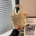 Detail of woven straw handbag with lace bow decoration and drawstring lining - Silk Scarf Lace Bow Style / Off White