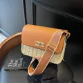 Chic woven straw crossbody bag with brown leather flap and adjustable wide strap - Off White
