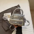 Silver metallic mini bowling bag with lace bow detail and checkered ribbon handle - Silver