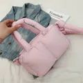 Stylish pink puffer quilted tote bag with soft padded handles and crossbody strap rings - Pink