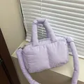 Light purple quilted puffer crossbody bag with knotted strap and silver zipper detail - Purple