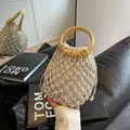Bohemian white woven bucket bag with wooden ring handles and canvas inner pouch - Off White