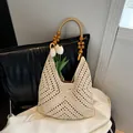 Chic cream hollow-out crochet hobo bag featuring decorative brown wooden beads - Solid Color / Off White