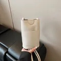 Mini cream litchi leather crossbody phone bag with front pocket and thin strap - Without Charm Style / Off White