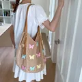Grand sac de plage en maille beige avec papillons colorés et bandoulière en cuir marron - Marron