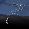 Detailed view of polished letter G pendant on stainless steel chain with lobster clasp - Letter G