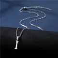Close-up of polished stainless steel necklace featuring a lucky letter I pendant - Letter I