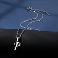 Macro shot of silver stainless steel necklace with artistic letter P pendant - Letter P