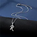 Detailed view of silver polished letter R pendant on a minimalist stainless steel chain - Letter R