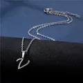 Macro shot of silver-colored letter V pendant with a polished brush texture on a chain - Letter V