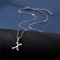 Macro shot of silver stainless steel letter X pendant with elegant fine chain necklace - Letter X