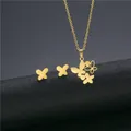 Minimalist gold butterfly jewelry set with necklace and stud earrings on pedestal - Three Butterflies Style (TZ-281 Gold)