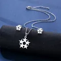 Silver stainless steel star necklace and earrings set on a dark textured display - Radiant Star Style (TZ-85)
