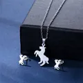 Polished silver horse-shaped silhouette necklace and stud earrings set on blue fabric - Jumping Horse Style (TZ-119)