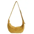 Detail of ginger yellow hobo bag with matte suede texture and adjustable knotted strap - Yellow