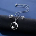 Detail of silver stainless steel necklace and earrings set featuring moon and star silhouettes - Moon Star Figures Silhouette Style (TZ-91)