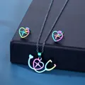 Rainbow stethoscope and heart necklace and earrings set on a navy jewelry box - Necklace And Earrings (TZ-350) / Colorful
