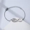 Macro detail of silver stainless steel chain bracelet with infinity love charm and lobster clasp - Infinity Love Style (NL6)