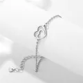 Bracciale minimalista in acciaio inossidabile argento con ciondoli a cuore intrecciati - Argento