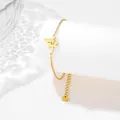 Elegante bracciale con libellula in acciaio inossidabile dorato su supporto bianco - Stile Libellula (XLJ38)