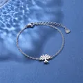 Macro view of stainless steel Tree of Life charm bracelet with water ripple reflection - Tree of Life Style (XLY28 Steel)
