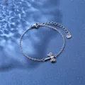 Macro detail of stainless steel dragonfly bracelet with heart tag and lobster clasp - Dragonfly Style (XLY30 Steel)