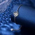 Polished stainless steel bracelet with palm leaf pendant on a premium blue display stand - Palm Leaf Style (XLY133)