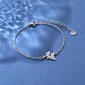 Macro detail of stainless steel dragonfly bracelet with lobster clasp and S.Steel heart tag - Double Dragonfly Style (XLY38 Steel)