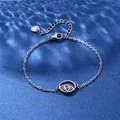 Silver stainless steel eye bracelet with hollow pendant on blue water ripple background - Evil Eye Style (XLY107)