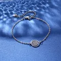 Silver stainless steel swirl charm bracelet with lobster clasp on water ripple background - Spiral Style (XLY117)