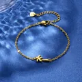Gold stainless steel coconut tree bracelet for beach vacations on blue satin fabric - Coconut Tree Style (XLJ111)