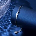 Minimalist silver stainless steel feather charm bracelet with adjustable extension chain - Feather Style (XLY128)