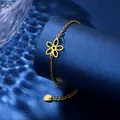 Bracciale in acciaio inossidabile dorato con ciondolo a fiore su elegante base blu - Oro