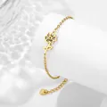 Bracciale floreale in acciaio dorato con pendente a fiore traforato ed effetti di luce - Ottobre